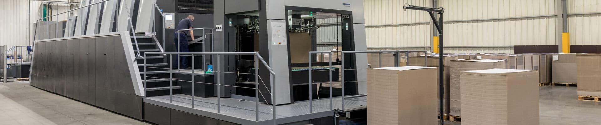 Modern industrial packaging facility with advanced printing and packaging equipment